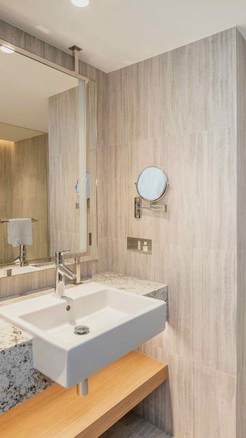 Bathroom countertop with sink and toiletries